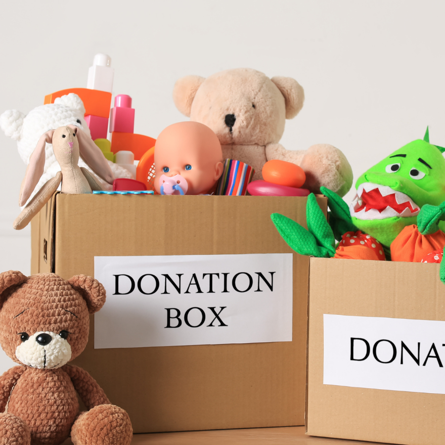 Stuffed animals in boxes labeled donations.